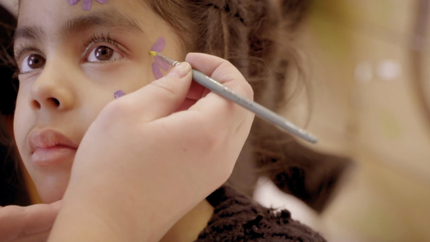 face painting a child