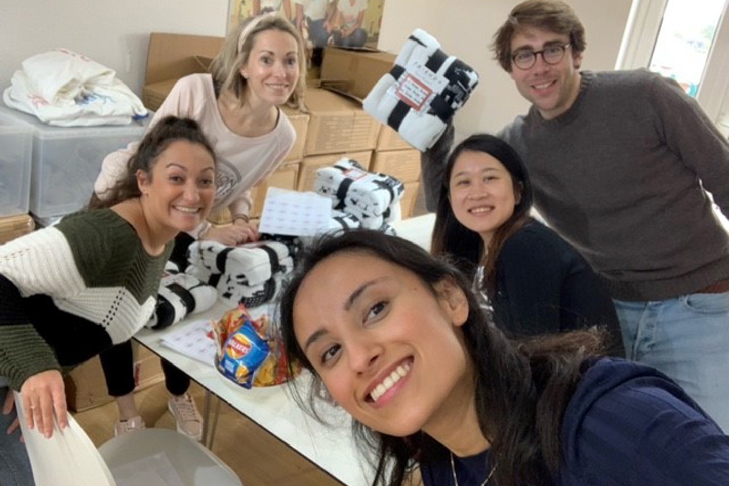 people smiling with presents