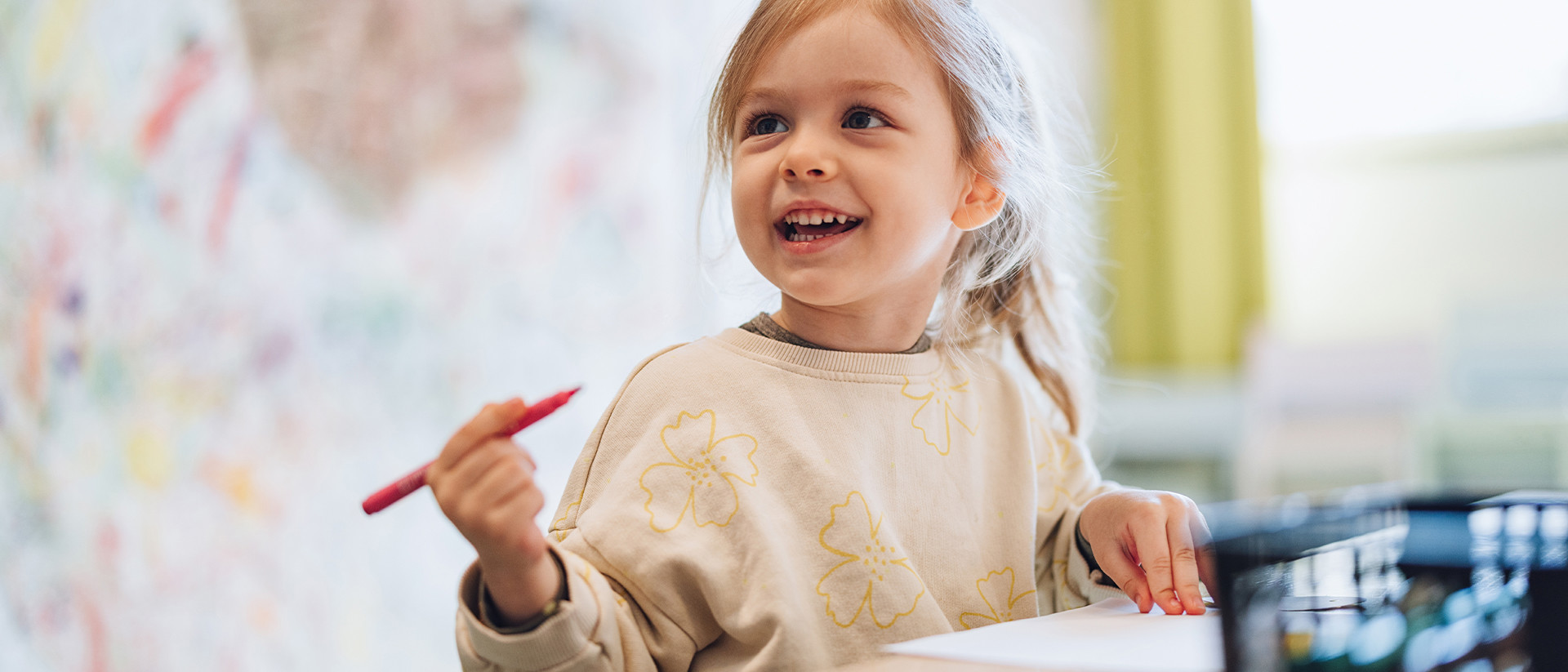 Spread a smile Header 4 Girl with colouring pencil