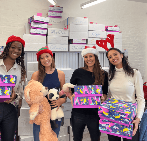 Spread A Smile Image volunteers with presents