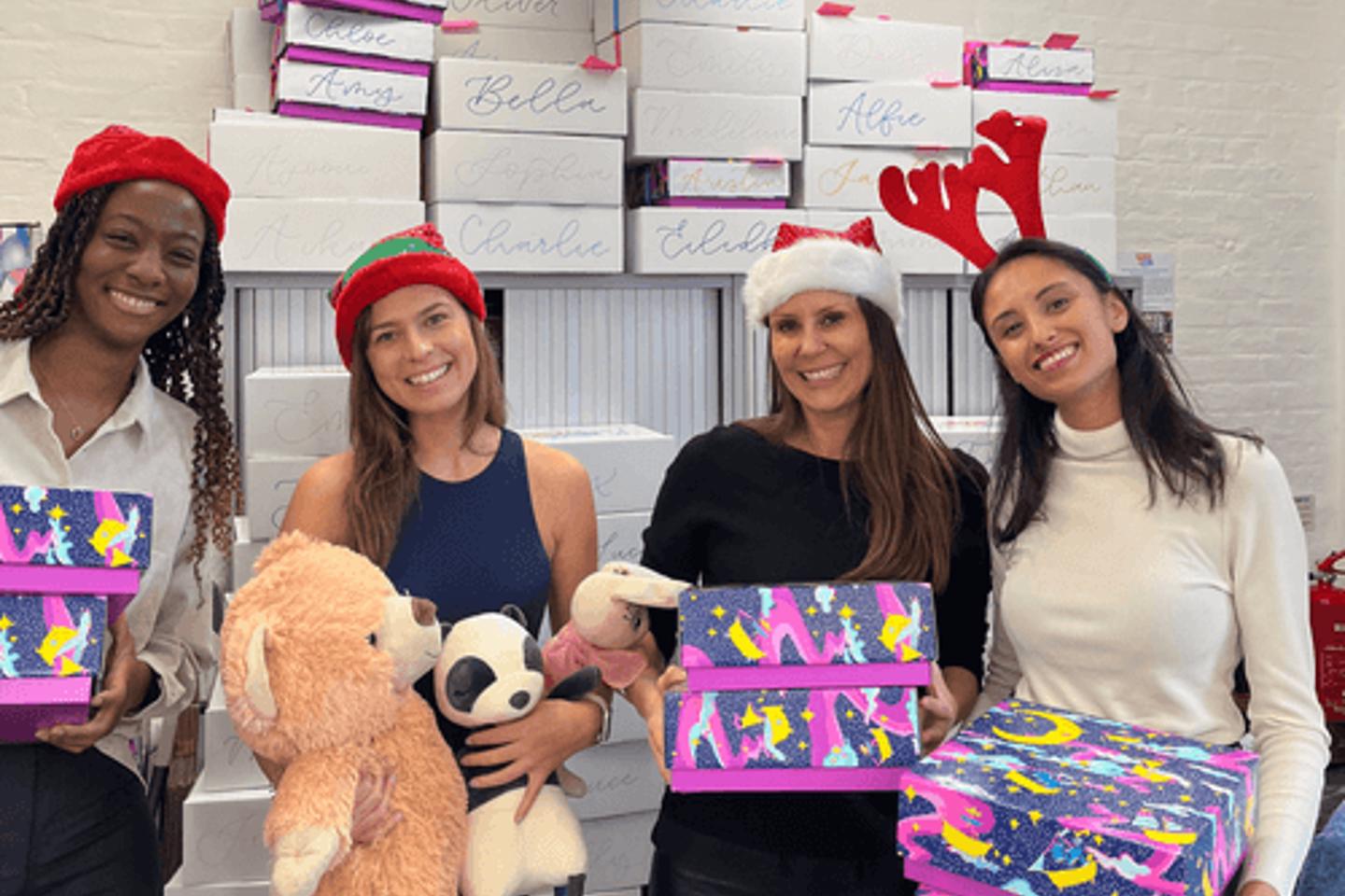 Spread A Smile Image volunteers with presents